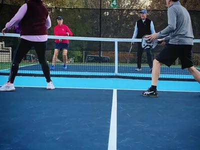Residents playing pickleball